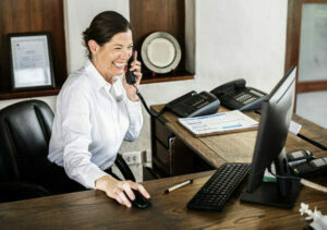 female-receptionist-working-at-the-front-desk